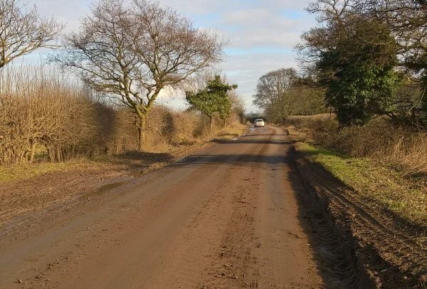 mud on a road causing a hazard